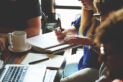 Group of people taking notes